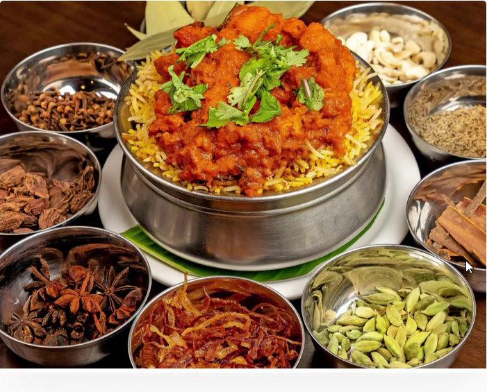 South Indian biryani surrounded by whole spices